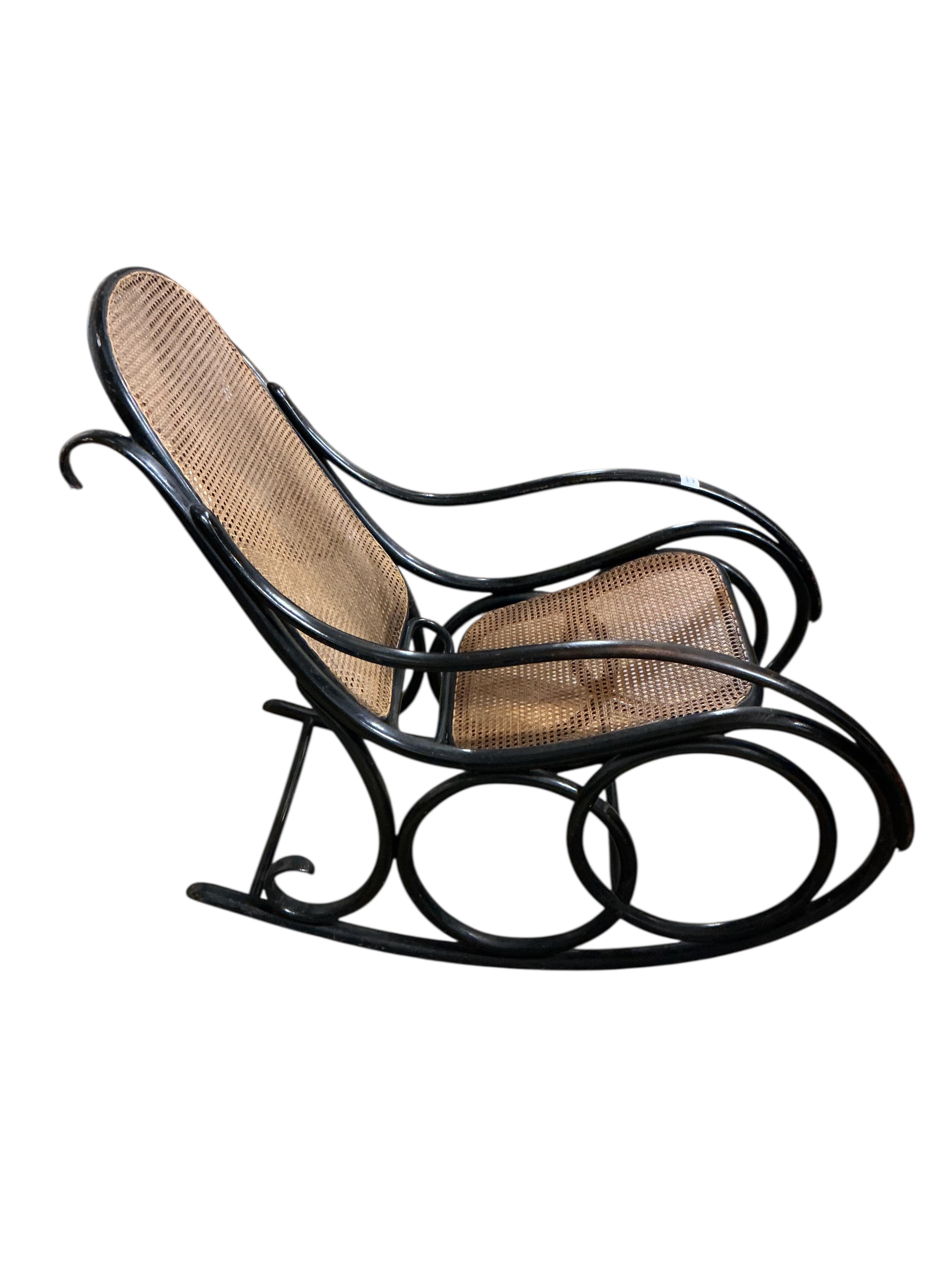 A Thonet ebonised bentwood rocking chair, width 54cm, depth 100cm, height 98cm
